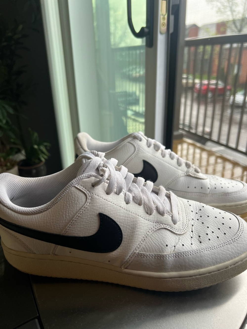 Nike White Low-Top Sneakers with Black Swoosh